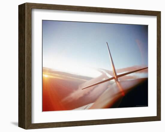 Vapor Trails Streaming from Tail of Jet in Flight-Howard Sochurek-Framed Photographic Print