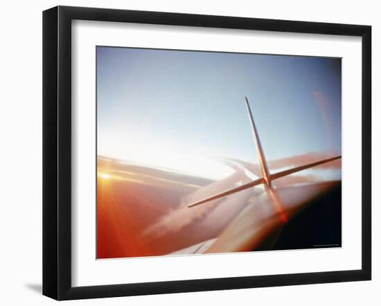 Vapor Trails Streaming from Tail of Jet in Flight-Howard Sochurek-Framed Photographic Print