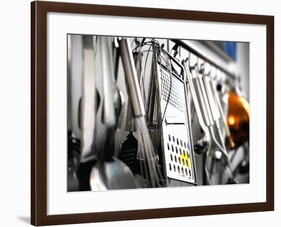 Various Kitchen Utensils Hanging on a Wall-null-Framed Photographic Print