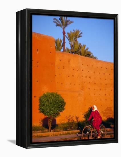 Veiled Woman Bicycling Below Red City Walls, Marrakech, Morocco-Merrill Images-Framed Premier Image Canvas