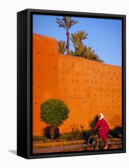 Veiled Woman Bicycling Below Red City Walls, Marrakech, Morocco-Merrill Images-Framed Premier Image Canvas