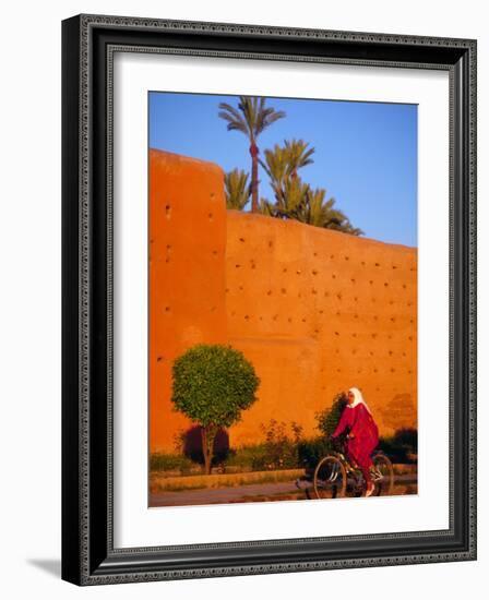 Veiled Woman Bicycling Below Red City Walls, Marrakech, Morocco-Merrill Images-Framed Photographic Print