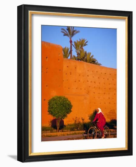 Veiled Woman Bicycling Below Red City Walls, Marrakech, Morocco-Merrill Images-Framed Photographic Print