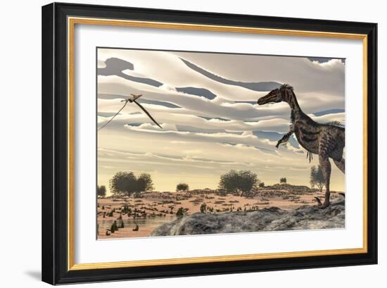 Velociraptor Dinosaur Observing a Pteranodon Flying over the Desert-Stocktrek Images-Framed Art Print