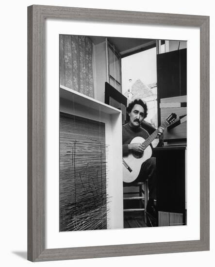 Venezuelan Kinetic Artist Raphael Jesus Soto, Playing Guitar in His Apartment-Pierre Boulat-Framed Premium Photographic Print