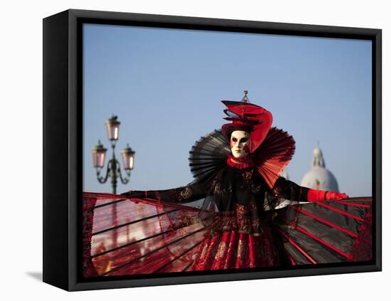 Venice, Veneto, Italy, a Mask in Costume on the Bacino Di San Marco with the Cupola of Santa Maria -Ken Scicluna-Framed Premier Image Canvas