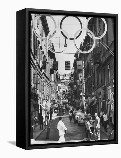 Via Frattina Decorated with Flags of the Competing Nations for the Olympics-null-Framed Premier Image Canvas