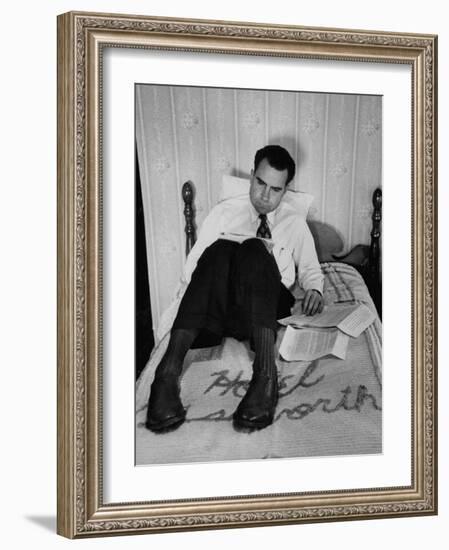 Vice Presidential Candidate Richard M. Nixon Sitting on His Hotel Bed Reviewing Paperwork-Cornell Capa-Framed Photographic Print