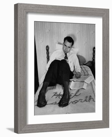 Vice Presidential Candidate Richard M. Nixon Sitting on His Hotel Bed Reviewing Paperwork-Cornell Capa-Framed Photographic Print