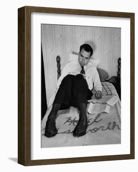 Vice Presidential Candidate Richard M. Nixon Sitting on His Hotel Bed Reviewing Paperwork-Cornell Capa-Framed Photographic Print