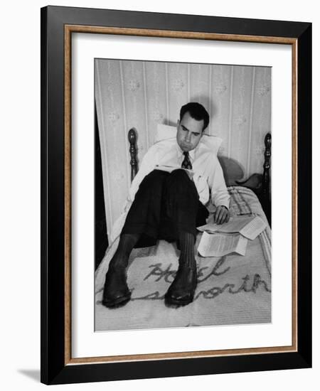 Vice Presidential Candidate Richard M. Nixon Sitting on His Hotel Bed Reviewing Paperwork-Cornell Capa-Framed Photographic Print