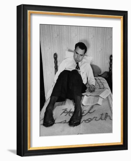 Vice Presidential Candidate Richard M. Nixon Sitting on His Hotel Bed Reviewing Paperwork-Cornell Capa-Framed Photographic Print