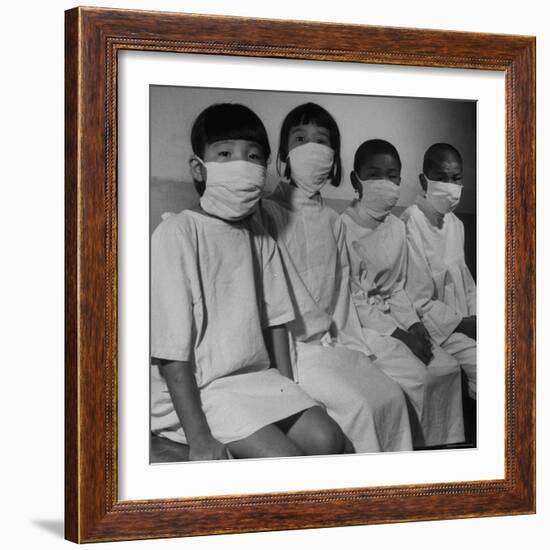 Victims of a Bomb in Hiroshima Waiting to Be Examined by A.B.C.C-Carl Mydans-Framed Photographic Print