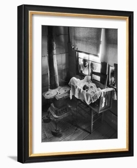 Victoria Cooper's Children Peering in Window Where Newborn Baby Lies in Crib Made from Fruit Crate-W^ Eugene Smith-Framed Photographic Print