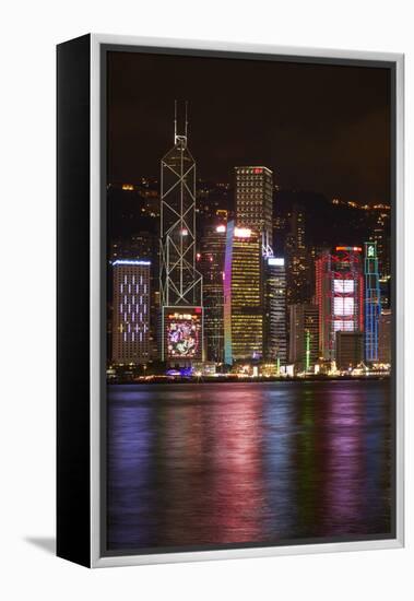 Victoria Harbor and light show on skyscrapers, Central, Hong Kong, China-David Wall-Framed Premier Image Canvas