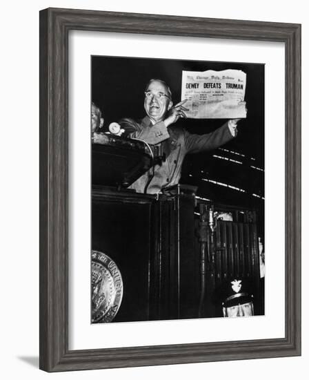 Victorious President Harry Truman Displaying Chicago Daily Tribune Headline, Dewey Defeats Truman-W^ Eugene Smith-Framed Photographic Print