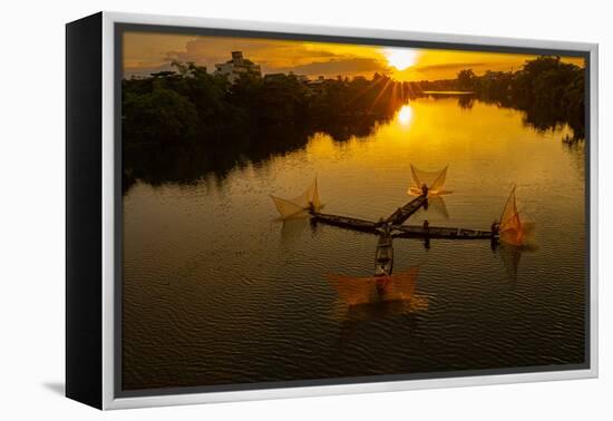 Vietnam. Coordinated lagoon fishing with nets at sunset.-Tom Norring-Framed Premier Image Canvas