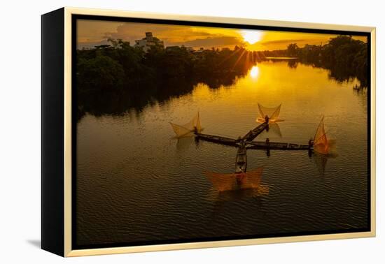 Vietnam. Coordinated lagoon fishing with nets at sunset.-Tom Norring-Framed Premier Image Canvas