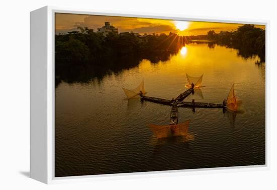 Vietnam. Coordinated lagoon fishing with nets at sunset.-Tom Norring-Framed Premier Image Canvas