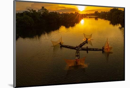 Vietnam. Coordinated lagoon fishing with nets at sunset.-Tom Norring-Mounted Photographic Print