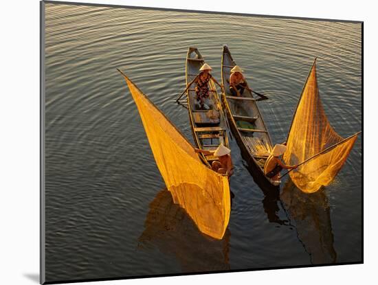 Vietnam. Coordinated lagoon fishing with nets at sunset.-Tom Norring-Mounted Photographic Print