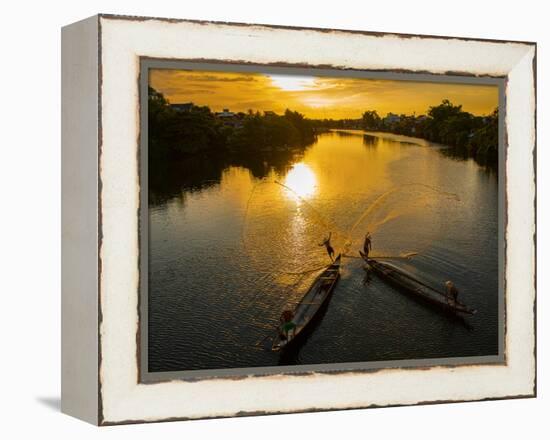 Vietnam. Coordinated lagoon fishing with nets at sunset.-Tom Norring-Framed Premier Image Canvas