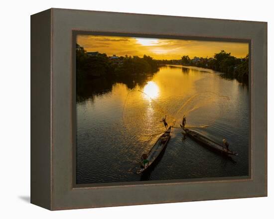 Vietnam. Coordinated lagoon fishing with nets at sunset.-Tom Norring-Framed Premier Image Canvas