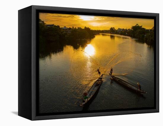 Vietnam. Coordinated lagoon fishing with nets at sunset.-Tom Norring-Framed Premier Image Canvas