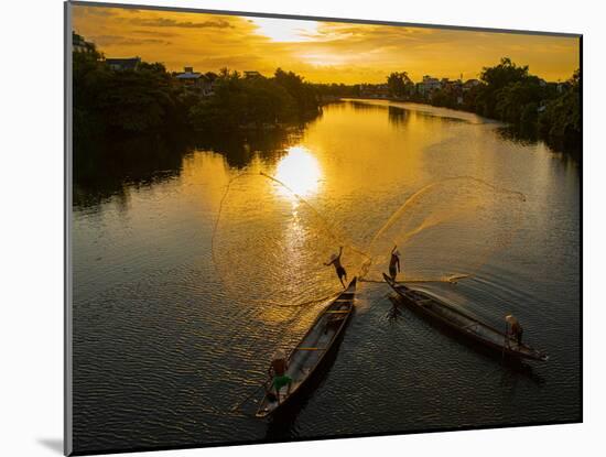 Vietnam. Coordinated lagoon fishing with nets at sunset.-Tom Norring-Mounted Photographic Print