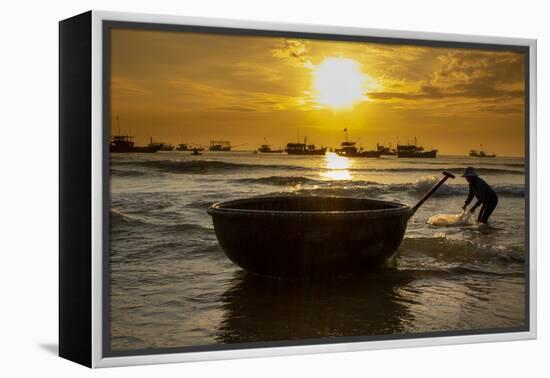 Vietnam. Fishermen deliver the nights catch to the beach at Hoi An.-Tom Norring-Framed Premier Image Canvas