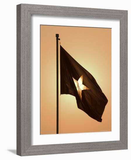 Vietnam Flag at Sunset, Hanoi, Northern Vietnam, Vietnam, Southeast Asia-Christian Kober-Framed Photographic Print