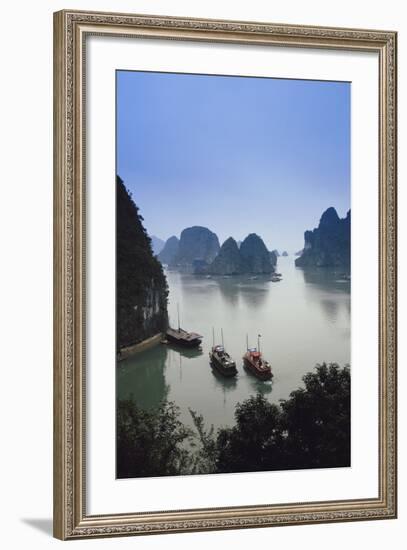 Vietnam, Halong Bay, Tourist Boats Anchor at the Cave of Marvels-Walter Bibikow-Framed Photographic Print