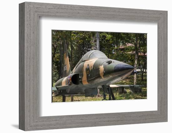 Vietnam, Ho Chi Minh City. Reunification Palace, Former South Vietnamese F-5E Fighter Plane-Walter Bibikow-Framed Photographic Print