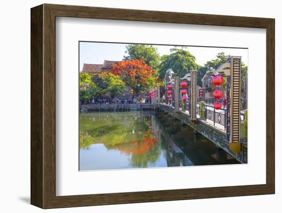 Vietnam. Hoi An bridge over the river with reflections and silk lamps.-Tom Norring-Framed Photographic Print