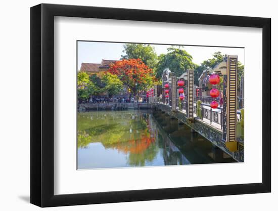 Vietnam. Hoi An bridge over the river with reflections and silk lamps.-Tom Norring-Framed Photographic Print