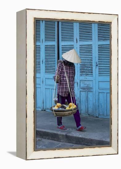 Vietnam. Street vendor with fruit and vegetable basket. Hoi Anh.-Tom Norring-Framed Premier Image Canvas