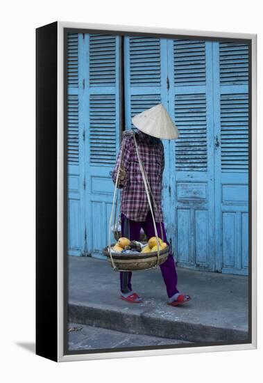 Vietnam. Street vendor with fruit and vegetable basket. Hoi Anh.-Tom Norring-Framed Premier Image Canvas