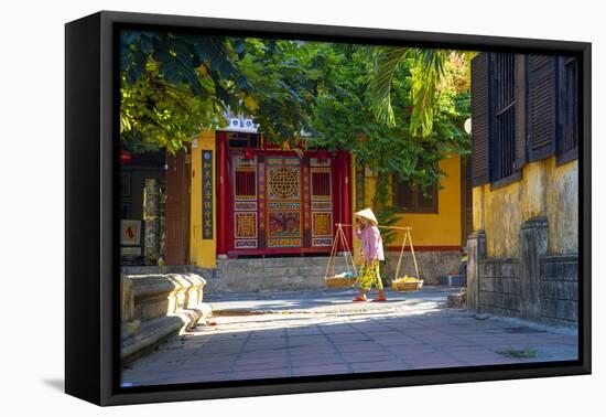 Vietnam. Woman with vegetable basket for sale.-Tom Norring-Framed Premier Image Canvas