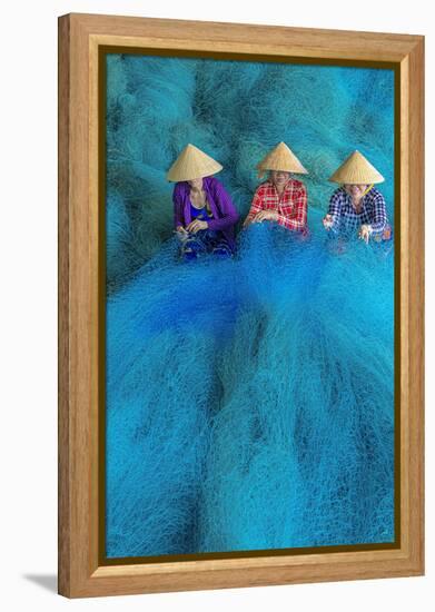 Vietnam. Women repairing fishing nets.-Tom Norring-Framed Premier Image Canvas