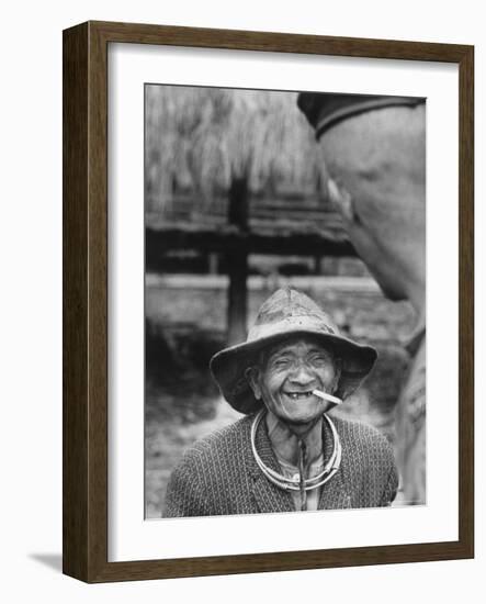Vietnamese Montagnard Man Smoking Cigarette-Larry Burrows-Framed Photographic Print