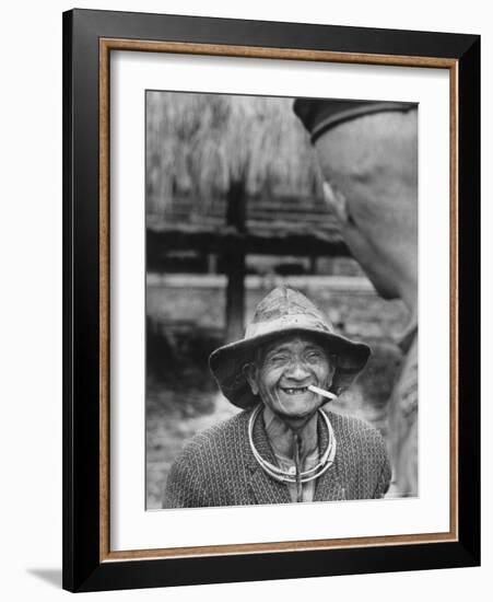 Vietnamese Montagnard Man Smoking Cigarette-Larry Burrows-Framed Photographic Print