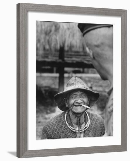 Vietnamese Montagnard Man Smoking Cigarette-Larry Burrows-Framed Photographic Print