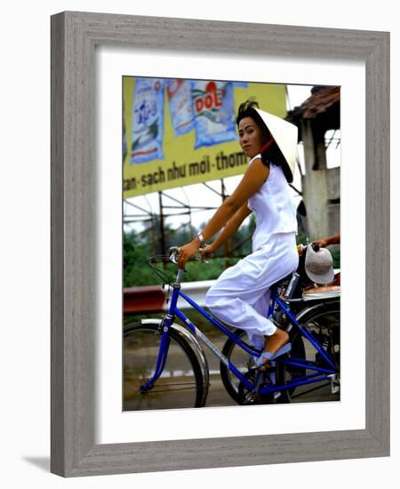 Vietnamese woman cycles in white clothes and hat-Charles Bowman-Framed Photographic Print