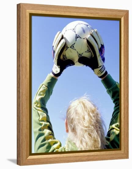 View from Behind of a Girl Holding a Soccer Ball-Steve Cicero-Framed Premier Image Canvas