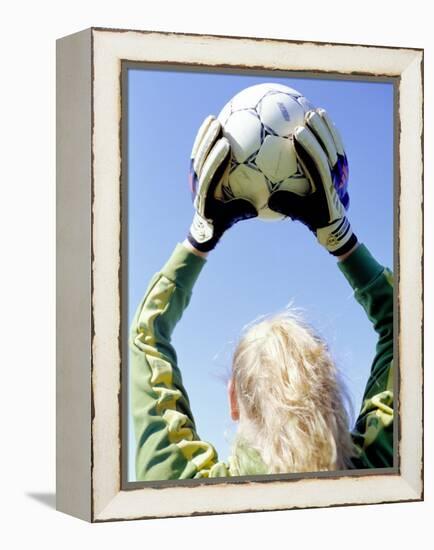 View from Behind of a Girl Holding a Soccer Ball-Steve Cicero-Framed Premier Image Canvas