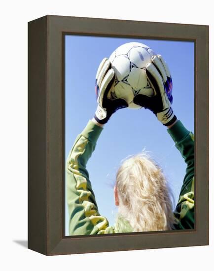 View from Behind of a Girl Holding a Soccer Ball-Steve Cicero-Framed Premier Image Canvas