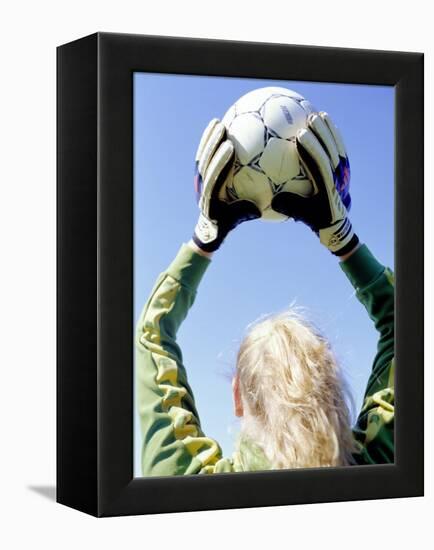 View from Behind of a Girl Holding a Soccer Ball-Steve Cicero-Framed Premier Image Canvas