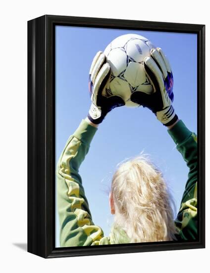 View from Behind of a Girl Holding a Soccer Ball-Steve Cicero-Framed Premier Image Canvas