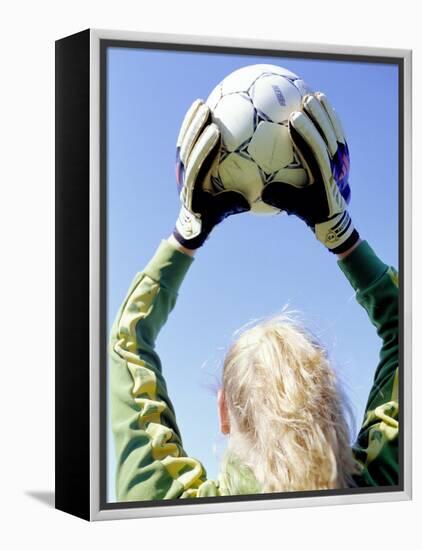 View from Behind of a Girl Holding a Soccer Ball-Steve Cicero-Framed Premier Image Canvas