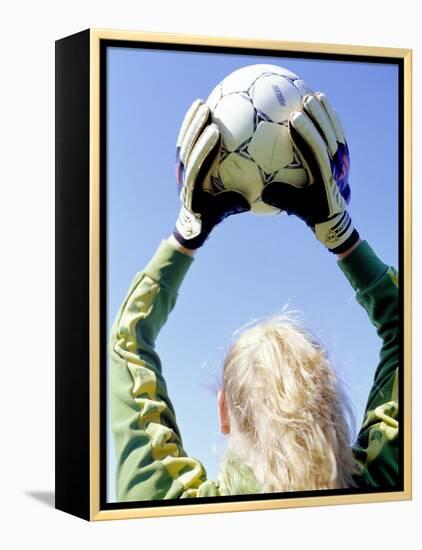 View from Behind of a Girl Holding a Soccer Ball-Steve Cicero-Framed Premier Image Canvas